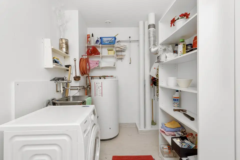 Utility room with a water heater